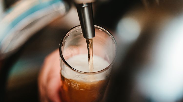 Close-up of filling from a beer tap at RuMa Hotel & Residences