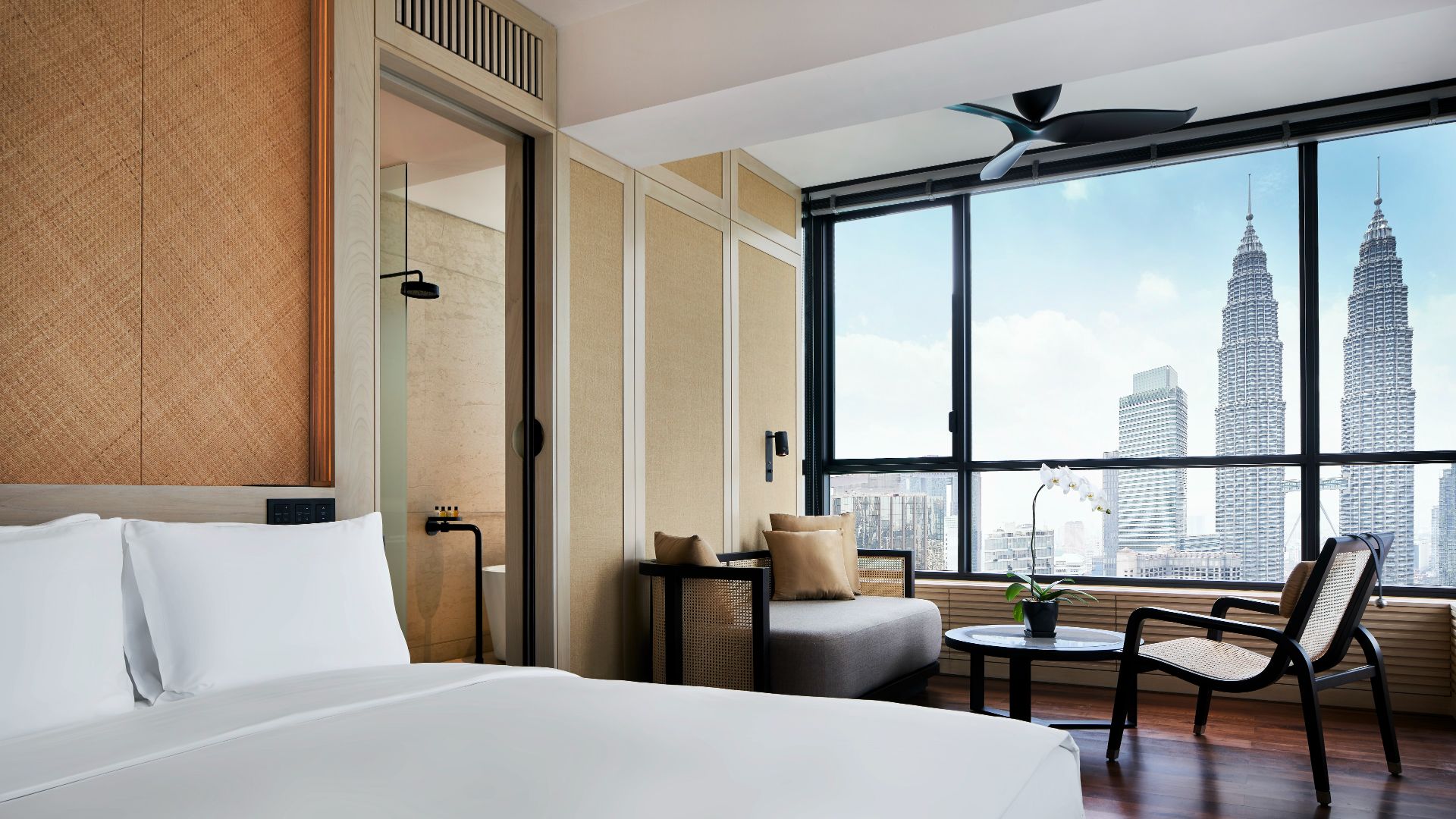 Deluxe Suite lounge with city view at RuMa Hotel & Residences