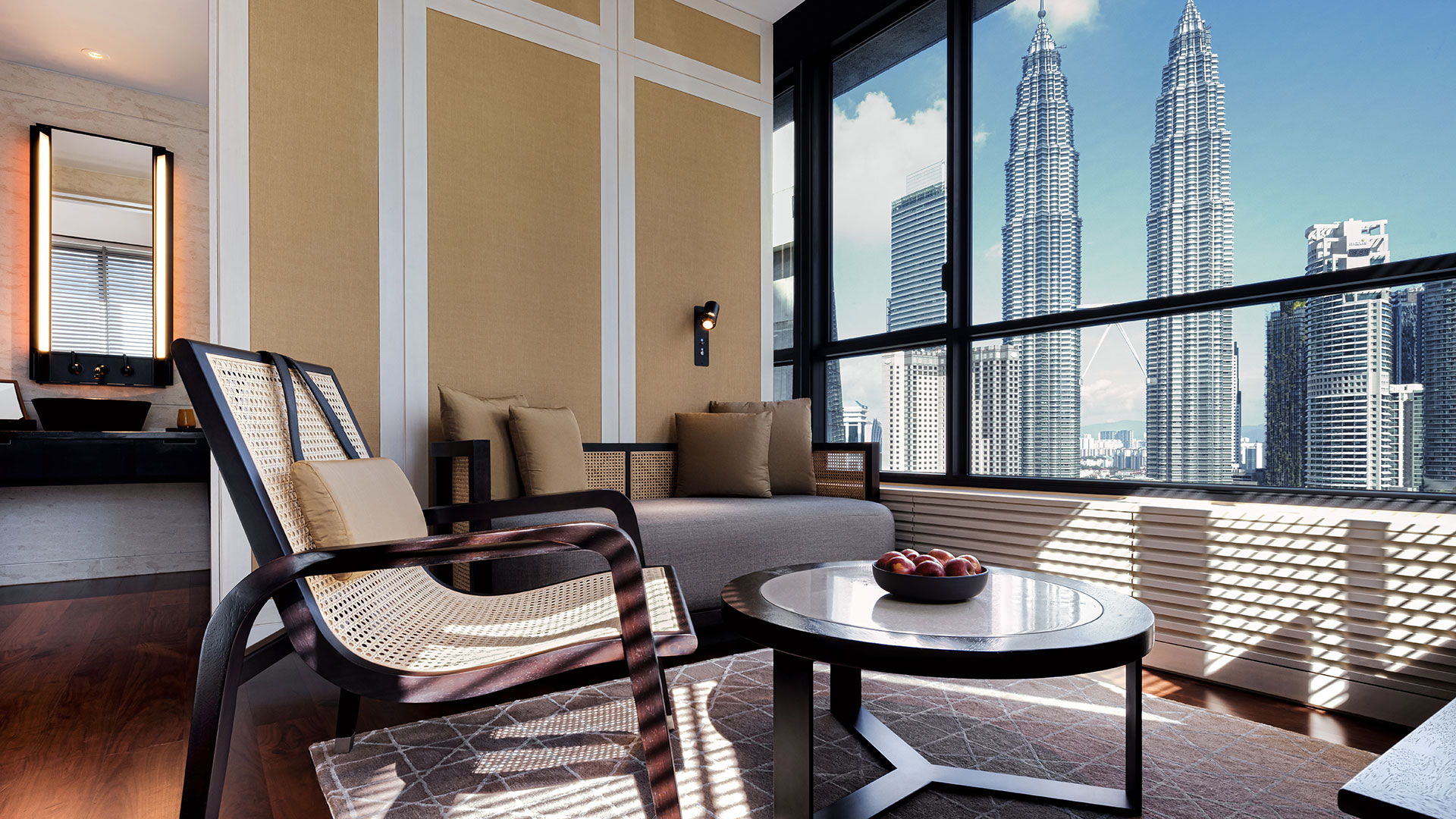 Deluxe Suite lounge with city view at RuMa Hotel & Residences